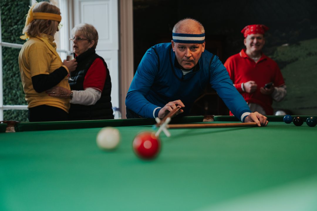 Man playing pool during a corporate event