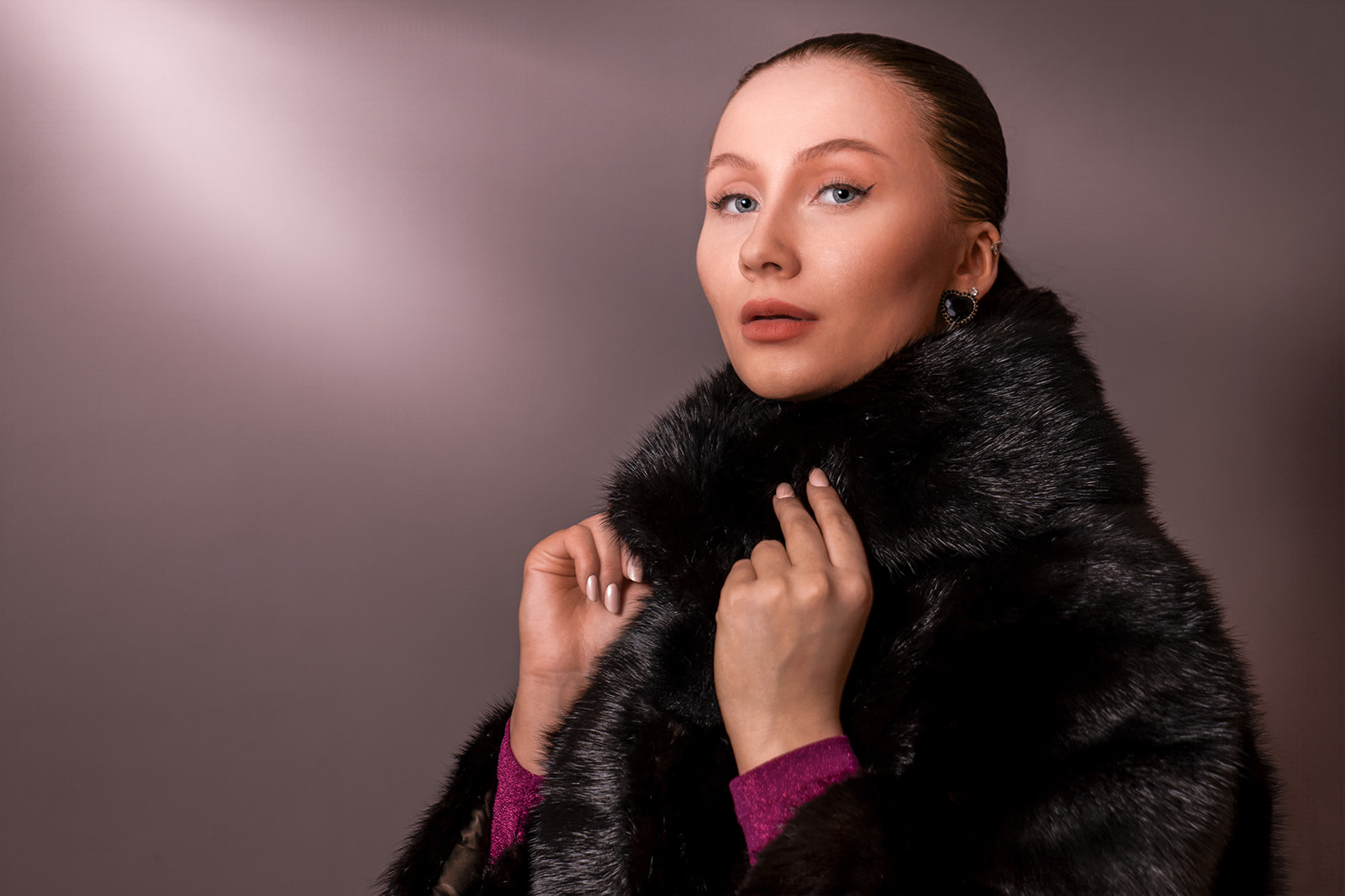 Portrait of a fashion model wearing a fur coat